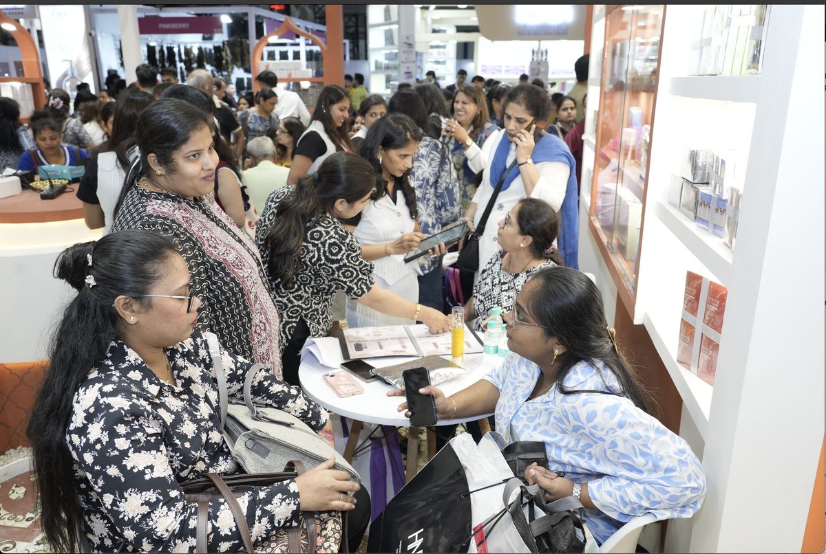 Salon professionals in a product consultation at the Serenite Professional booth, Professional Beauty India Mumbai 2026